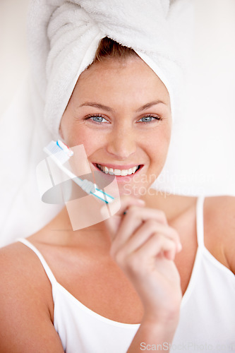 Image of Portrait, happy woman and brushing teeth with shower towel for healthy dental wellness. Face of female person cleaning mouth with toothbrush, toothpaste and fresh breath of smile, cosmetics and care