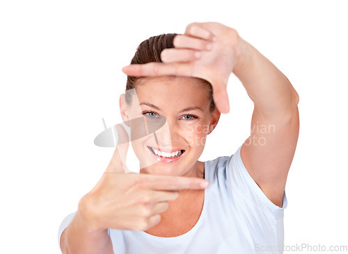 Image of Portrait, finger frame and happy woman in white background, isolated studio and review profile picture. Face, female model and hands for perspective, selfie and inspiration for creative photography