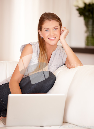 Image of Happy, laptop and portrait of woman on sofa in living room for social media, streaming and website. Search, technology and digital with female user typing at home for connection, email and internet