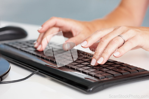Image of Hands, typing and closeup of business woman on a computer in office for planning, research and email marketing. Keyboard, fingers and person online for management, proposal and review or report