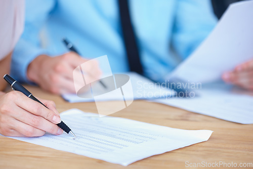 Image of Business people, hands and writing on spreadsheet for finance paperwork or budget expenses on office desk. Hand of accountant team with financial report, documents or account with pen during audit