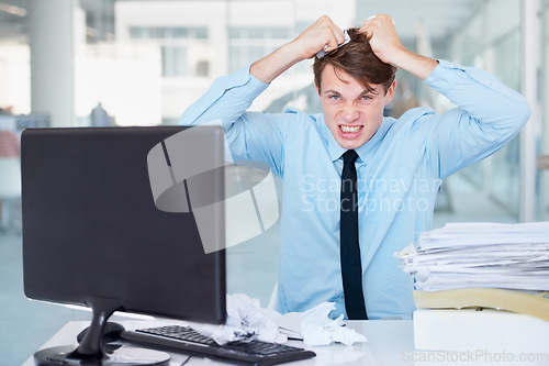 Image of Portrait, stress or pulling hair with a businessman in an office, feeling anger while working on a problem or crisis. Audit, tax and compliance with a young employee suffering from burnout at work