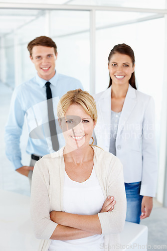 Image of Portrait, woman leadership and business people with arms crossed for teamwork in office. Collaboration, leader and happy group of employees, man and women, team building and confidence in workplace.