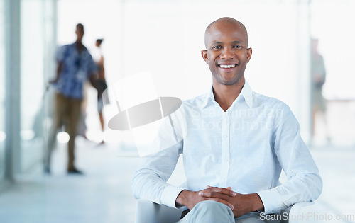 Image of Portrait, business and smile of black man on chair in office with pride for career or job. Professional, male entrepreneur and happy African person from Nigeria sitting in corporate workplace.