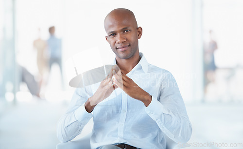 Image of Portrait, business and serious black man on chair in office with pride for career, job or occupation. Professional, male entrepreneur and confident African person from Nigeria sitting in workplace.