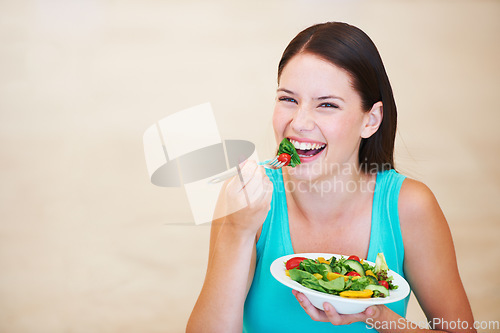 Image of Woman, portrait and laughing with healthy food or salad with vegetables, nutrition and health benefits. Happy female person on a nutritionist diet and eating vegan for weight loss, wellness or mockup