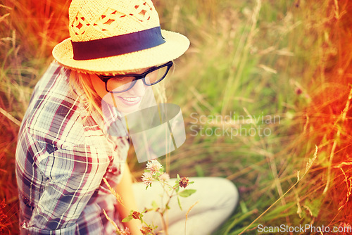 Image of Summer, countryside and woman with lens flare in field for freedom, wellness and happiness outdoors. Nature, flowers and female person in natural meadow for relaxing, calm and peaceful in morning