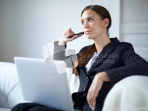 Image of Business woman, sofa and laptop for thinking with mindset, memory or idea for vision in home office. Entrepreneur, freelancer and computer with focus, goal or remote work with pen, research or tech