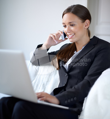 Image of Business woman, phone call and laptop on sofa in home office with smile, listen or communication. Young entrepreneur, remote work and computer with smartphone for networking, talk and data analysis