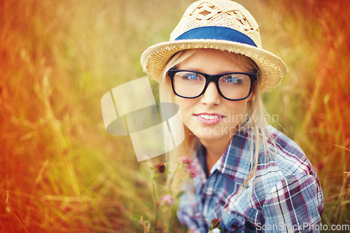 Image of Lens flare, countryside and portrait of woman in field for freedom, wellness and fresh air outdoors. Nature, summer and face of hipster female person in meadow for relaxing, calm and peace in morning