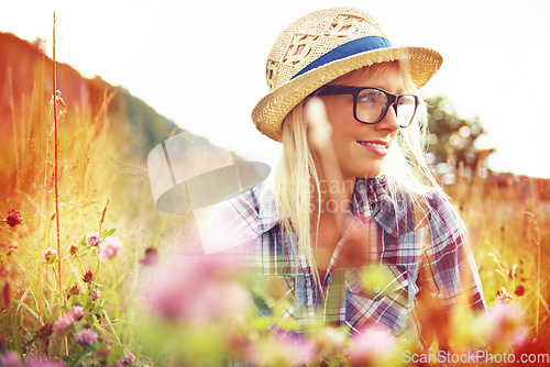 Image of Thinking, countryside and woman with lens flare in field for freedom, wellness and fresh air outdoors. Nature, hipster and female person in natural meadow for relaxing, calm and peace in morning