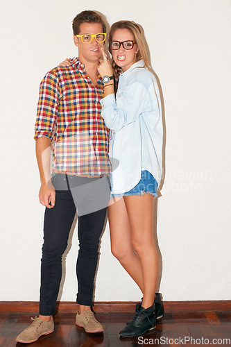 Image of Crazy portrait of hipster couple with glasses, funny face and gen z fashion with university youth culture. Happiness, goofy woman and man in at fun college, students on white wall background.