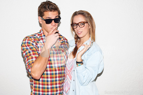 Image of Party portrait of hipster couple on wall background, sunglasses and gen z fashion in university youth culture. Fun, woman and man in picture at college event or cool kids at happy celebration or date