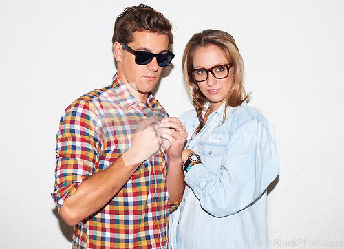 Image of Portrait of cool people, hipster couple with glasses and gen z fashion, university culture of youth. Fun, young woman and man in casual clothes at college date, students on white wall background.