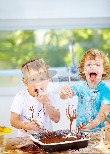 Image of Portrait, baking and children with messy friends in the kitchen together, having fun with ingredients while cooking. Kids, food and bake with naughty brothers making a mess on a counter in their home