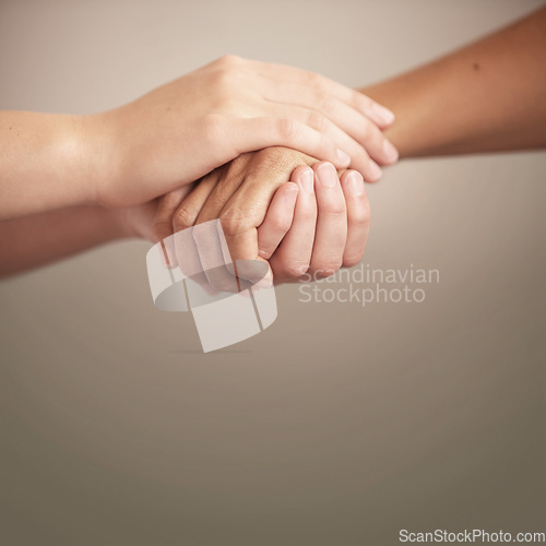 Image of Empathy, support and help with people holding hands in comfort, care or to console each other. Trust, love or healing with friends praying together during depression, anxiety or the pain of loss