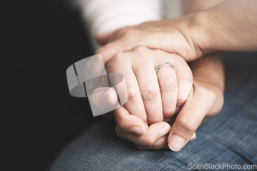 Image of Empathy, trust and love with people holding hands in comfort, care or to console each other. Support, help or healing with friends praying together during depression, anxiety or the pain of loss