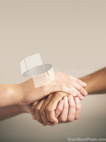 Image of Help, support and love with people holding hands in comfort, care or to console each other. Trust, empathy or healing with friends praying together during depression, anxiety or the pain of loss