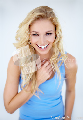 Image of Portrait, happy woman and laughing in studio, white background and isolated for happiness, confidence and smile. Female model in good mood, positive personality and laughter of funny, comedy and joke