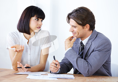 Image of Business people in discussion about paperwork in meeting, team in conference room and collaboration. Data analysis, employees coworking with man and woman in office, teamwork and review documents