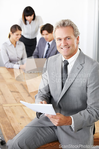 Image of Business man in portrait, leadership in meeting with paperwork and corporate CEO in conference room. Senior executive male smile, presentation and professional businessman in workplace with pride