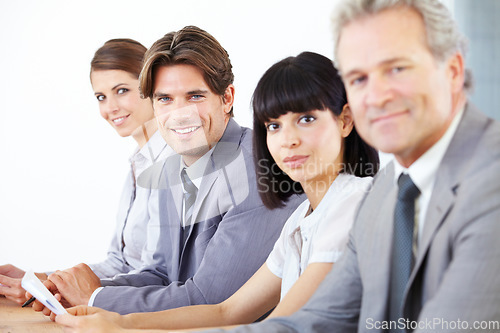 Image of Portrait, collaboration and a team of business colleagues sitting in the boardroom for a strategy meeting. Teamwork, planning or training with corporate men and women working together in the office