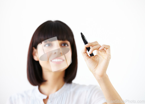 Image of Business woman, writing and smile for schedule, planning or strategy against a white studio background. Happy female employee in brainstorming, project plan or tasks for ideas or reminder on mockup