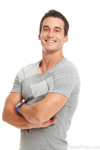 Image of Man, portrait and arms crossed in studio with pride and casual fashion with a smile. White background, male person and model confidence with strong, style and tshirt with happiness and smiling