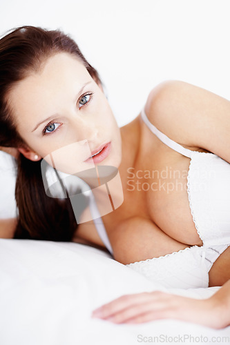 Image of Lingerie, boobs and portrait of a woman on a bed showing body and bra underwear for beauty, fashion and sexuality. Sexy female model in a house or hotel for desire, seduction and feminine art deco