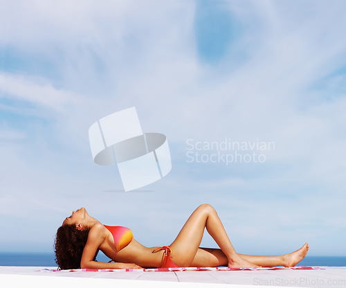 Image of Relax, sexy and bikini with body of woman at beach for sunbathing, tropical and peace on Brazil vacation. Summer break, sun and blue sky with girl tanning on deck of resort for travel and mockup