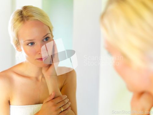 Image of Skincare, beauty and mirror with woman in bathroom for spa, facial and anti aging product. Wellness, luxury and shower with face of girl in reflection at home for cosmetics, cleaning and self care