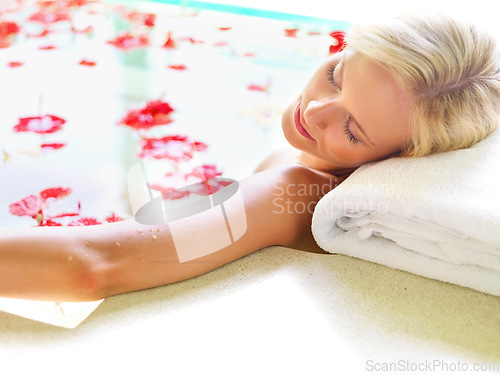 Image of Relax, spa and flowers with woman in bath for skincare, aromatherapy or tropical vacation in Bali villa. Summer, beauty and luxury with girl in jacuzzi for spa, hotel and resort on travel destination