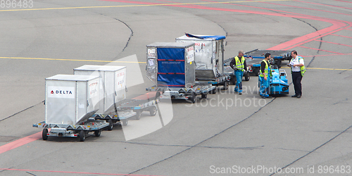 Image of AMSTERDAM - JUNE 29, 2017: Planes are being loaded at Schiphol A