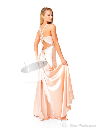 Image of Beauty, elegant and fashion in a long dress or evening gown for prom, event or fancy party against white studio background. Beautiful and confident woman showing open back detail of bridesmaid outfit