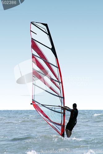 Image of Silhouette of a windsurfer on waves of a sea 2 