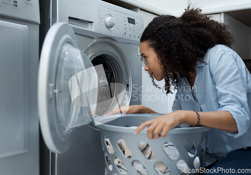 Image of Woman, laundry and washing machine, cleaner with basket and housekeeping with dryer and hygiene. Housekeeper service, female person doing housework and chores, cleaning clothes and electric appliance