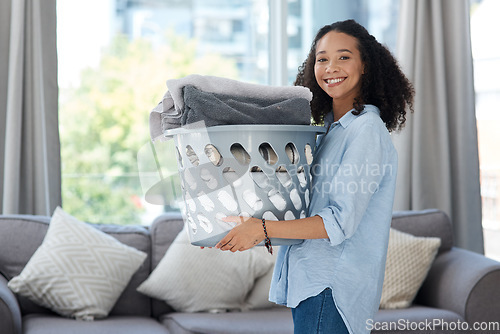 Image of Laundry, portrait and happy woman with basket of clean clothes, fabric and textile at home. Female person, cleaning service and container for clothing, housekeeping and maintenance care in apartment