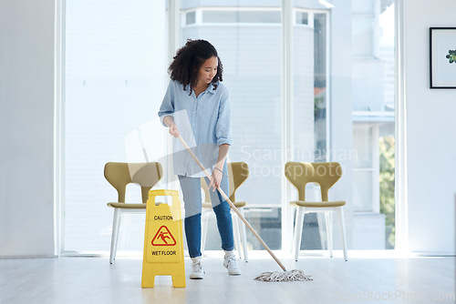 Image of Cleaning, floor and woman mopping with caution in building of maintenance, hygiene and dirt. Mop, janitor service and cleaner with warning sign, notice and safety information on ground tiles at home