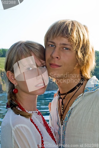 Image of Portrait of the young beautiful couple outdoors