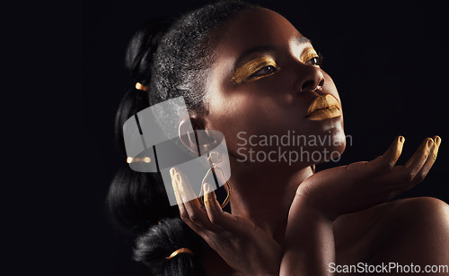 Image of Makeup, glitter and black woman in studio for beauty, luxury and body care on black background, Gold, art and African female model with wealth, glow and jewellery, elegance and posing royal aesthetic