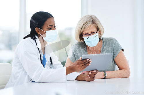 Image of Doctor, woman and tablet for consulting with mask, talking and advice for healthcare, wellness and support. Medic, patient and hospital for covid with mobile touchscreen app, results and feedback