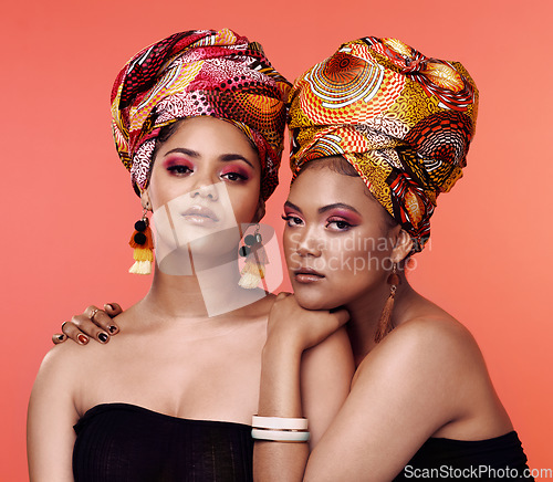 Image of African fashion, beauty and portrait of women on orange background with cosmetics, makeup and accessories. Glamour, friends and female people with exotic jewelry, traditional style and head scarf