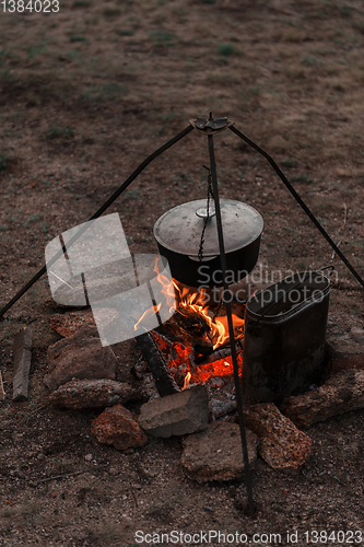 Image of Preparing food on campfire