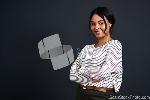 Image of Smile, mockup and portrait of a young woman arms crossed isolated in a black background studio with casual style. Happiness, happy and African female person feeling confident in her fashion