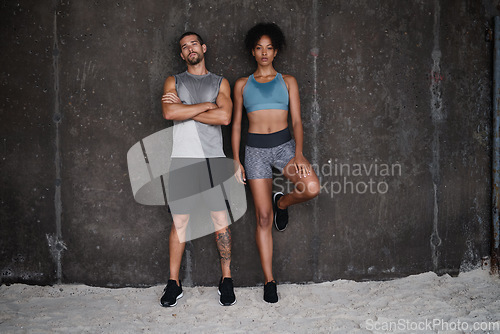 Image of Exercise, serious and portrait of couple on wall background for workout, body builder training and fitness. Sports, space and man and woman sweat after running for endurance, wellness and health