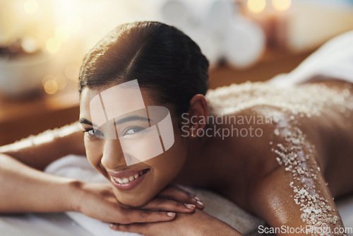 Image of Happy woman, face and portrait at spa for back massage, skincare or beauty in body treatment. Calm female lying on bed in relax with smile for exfoliation, zen or physical therapy wellness at salon
