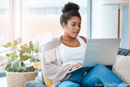 Image of Woman, laptop and on home sofa while typing email or communication. Real female person relax on a couch with internet connection and tech to chat on social media, website or do online shopping