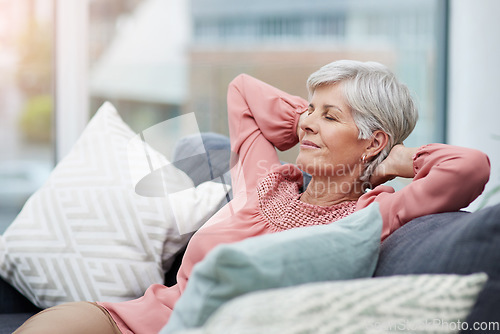 Image of Senior woman, relief and relax on sofa in home living room with peace, silence and happiness with free time. Elderly lady, retirement and lounge couch with freedom, sleep and happy for lifestyle