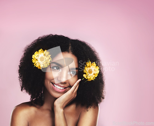 Image of Happy woman, thinking and flowers in hair in studio, pink background and mockup for aesthetic cosmetics. Face, african model and thought with floral plants, afro and beauty ideas for natural skincare