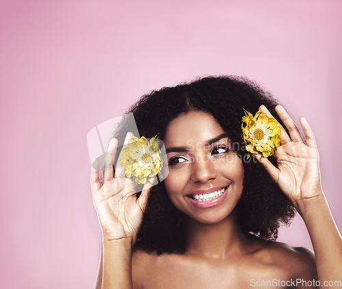Image of Happy woman, hair care and thinking with flowers in studio, pink background and sustainable mockup. Face, african model and daisy plants in afro to think of natural skincare, beauty ideas and makeup